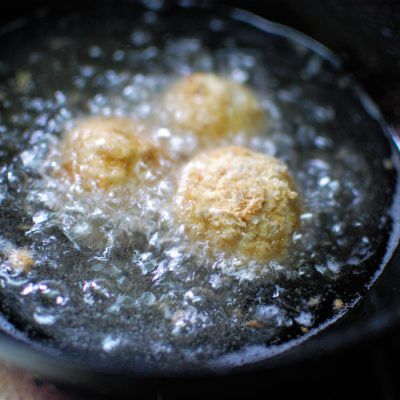 frying corn cheese balls in hot oil