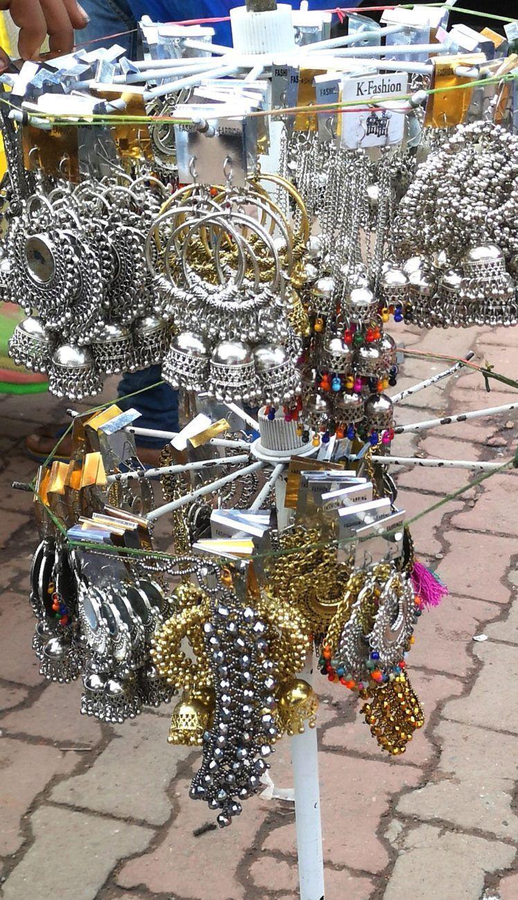 silver, junk,boho, colorful earrings on display at Sarojini Nagar
