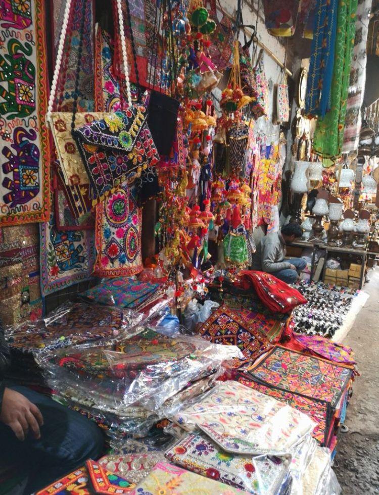 colorful, traditional, embroidered handbags and decorative items at display at Sarojini Market, Delhi 