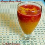 close up photo of mango, strawberry milkshake served in a glass , how to make mango berry shake