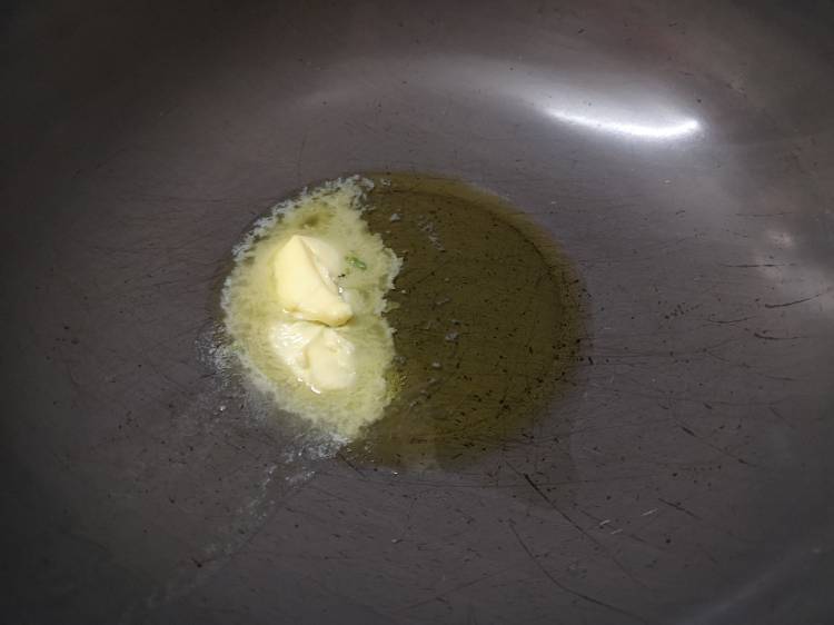 heating buter in a kadai for garlic mushroom recipe