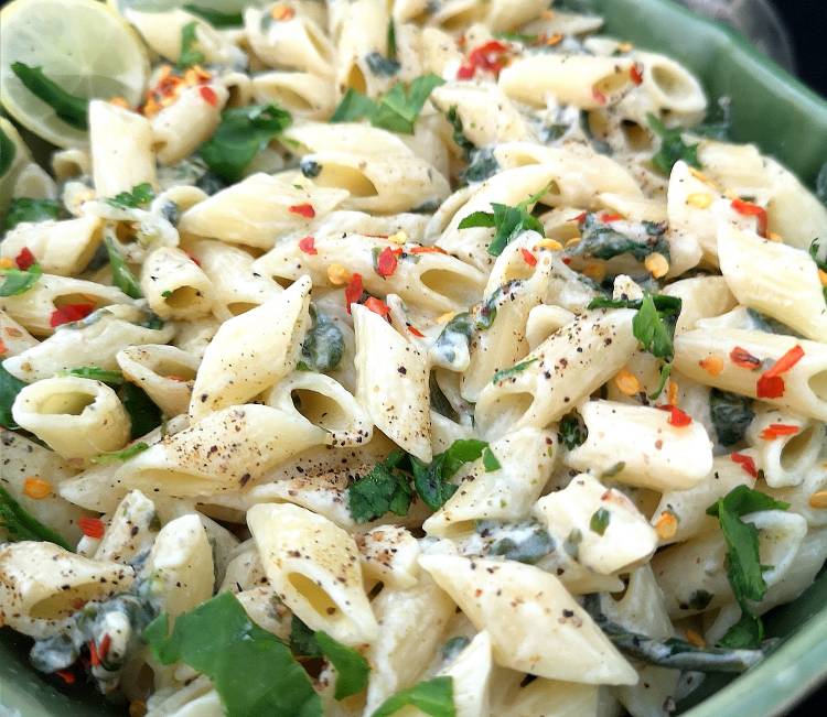 close up view of Vegan Lemon Pasta ,Pasta al Limone with red chili flakes and spinach