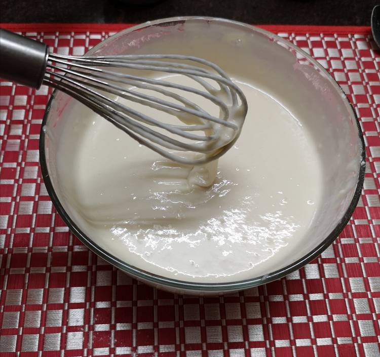 whisking nutella pancake batter with a wire whisk