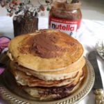 Stacks of Nutella Pancakes stuffed with Nutella discs