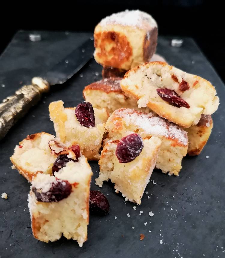 Showing the inside of syrniki, cottage cheese squares cooked in butter and served with dry cranberries, how to make Russian Cheese