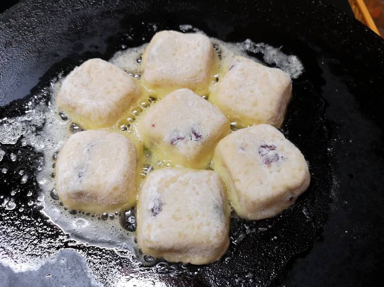 Syrniki pieces being cooked in butter on cast iron tawa, how to make Russian Cheese