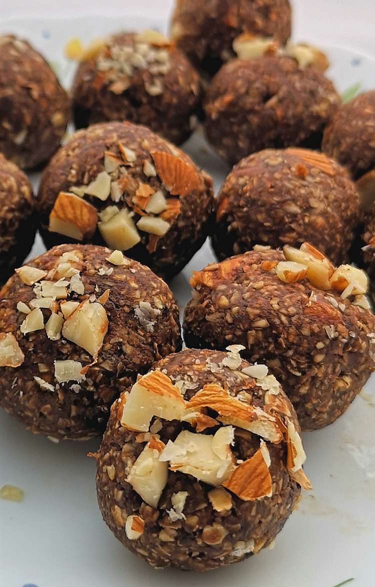 close up view of Brownie Energy Bites topped with crushed roasted almond