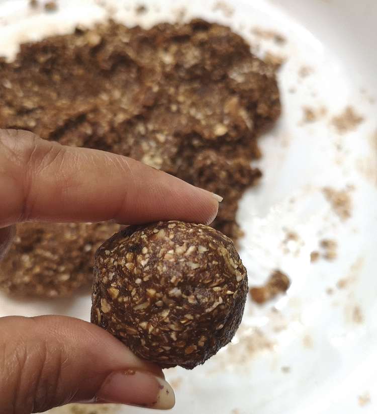 close up view of Brownie Energy Bites, ready to be rolled 