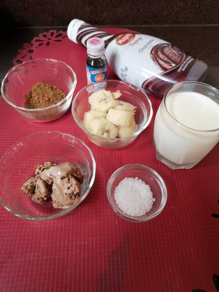 coco powder, banana, chocolate ice cream milk and vanilla essence for chocolate banana milkshake ipec