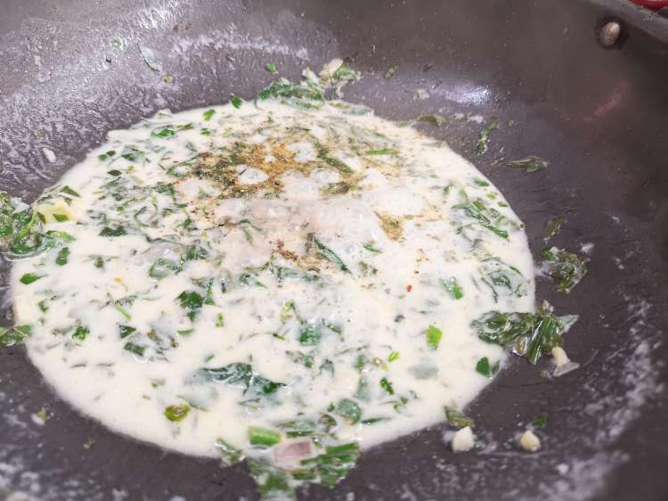 close up picture of coconut cream, cooked spinach, spices How to make Pasta al Limone