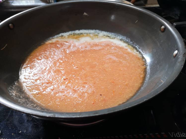 Adding gravy in Paneer Butter Masala Recipe