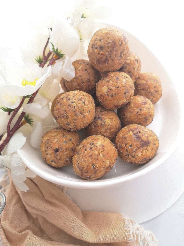 Piles of round peanut butter energy balls ready to be eaten, how to make PB energy balls