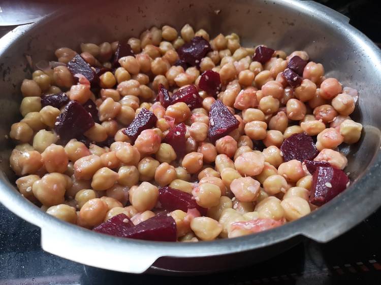 recipe of roasted beetroot hummus , mixing boiled white chickpeas and beetroot together in a pan