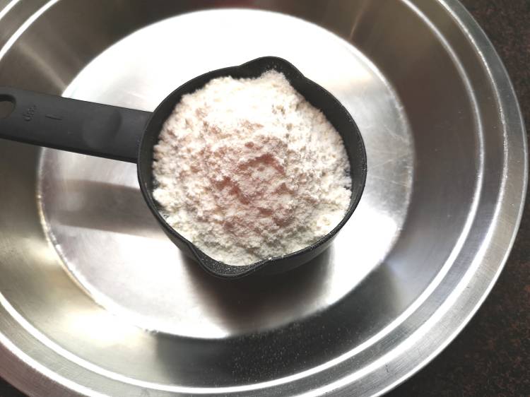 all purpose flour into a bowl for bhatura recipe, chole bhatura