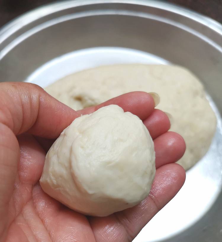 pinching a small ball for bhatura recipe