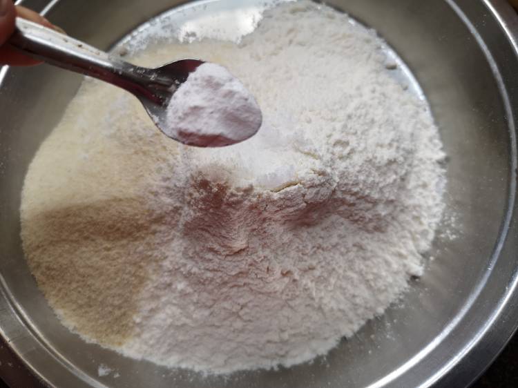 add baking powder into the flour for preparing instant Bhatura Recipe