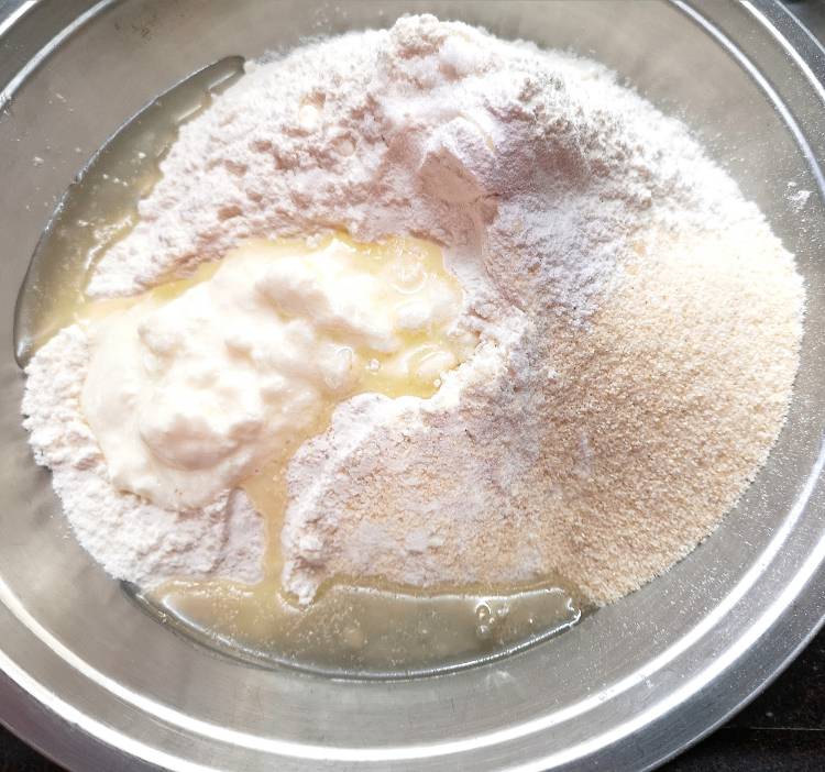 mxiing all-purpose flour, semolina, baking soda, baking powder for the bhatura dough