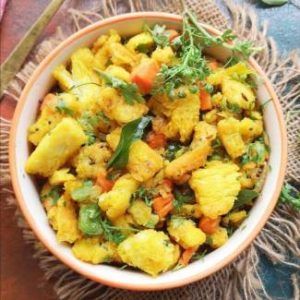 Close up view of bread upma recipe garnished with fresh coriander leaves