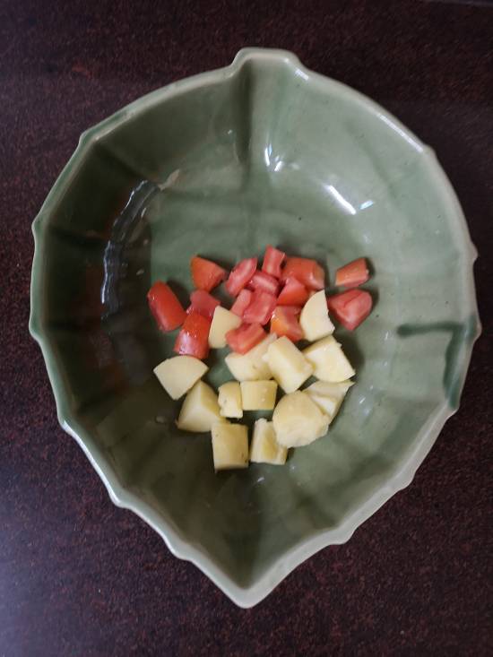 boiled potatoes and tomatoes in a bowl