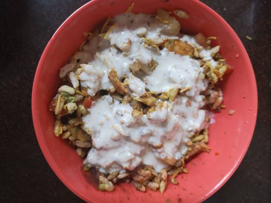 mixing sweetened yogurt, curd to dahi bhel recipe