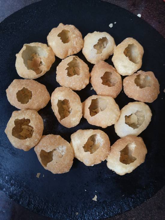 making holes in golgappa puri for dahi ragda puri recipe