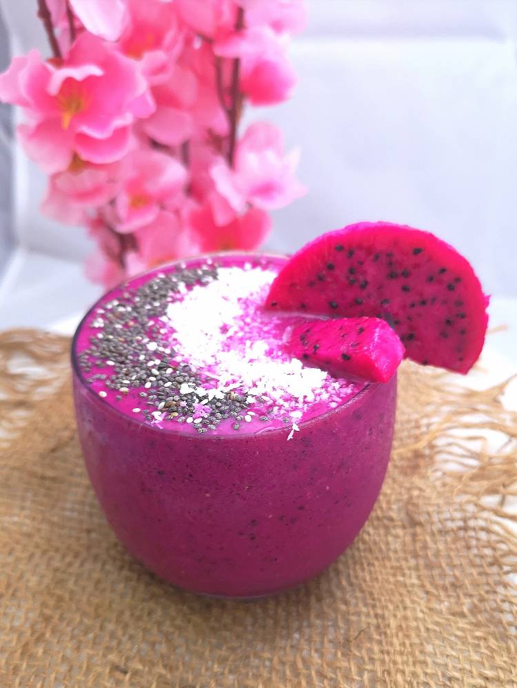 Dragon Fruit Smoothie served in a glass and topped with dry coconut and chia seeds,  Covid  fighting Dragon Fruit , recipe of pink dragon fruit smoothie