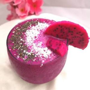 recipe of dragon fruit smoothie/Dragon Fruit Smoothie served and garnished with dry coconut and chia seeds and a slice of dragon fruit