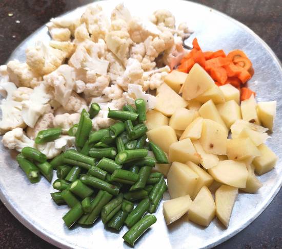 cauliflower, carrot, french beans and potatoes for Mix Vegetable Curry Recipe