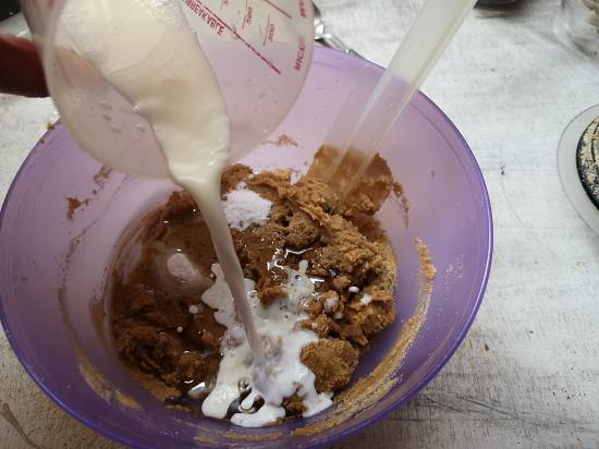 adding cold milk to parle g biscuit cake batter, How to make biscuit cake