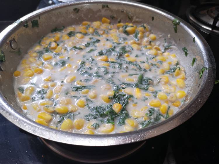 creamy and delicious spinach, sweet corn stuffing being cooked for grilled sandwich