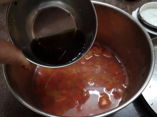 adding tamarind pulp in tomato pulp, how to make Tamil style Tomato Rasam