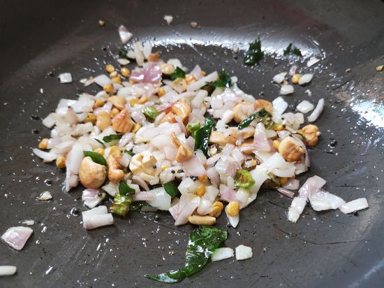 roasting onions and cashew nuts for upma recipe
