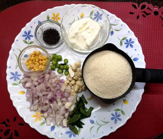 Rava/ Semolina, onions, cashew nuts, onion, curd, chana dal and mustard seeds for making Upma Recipe
