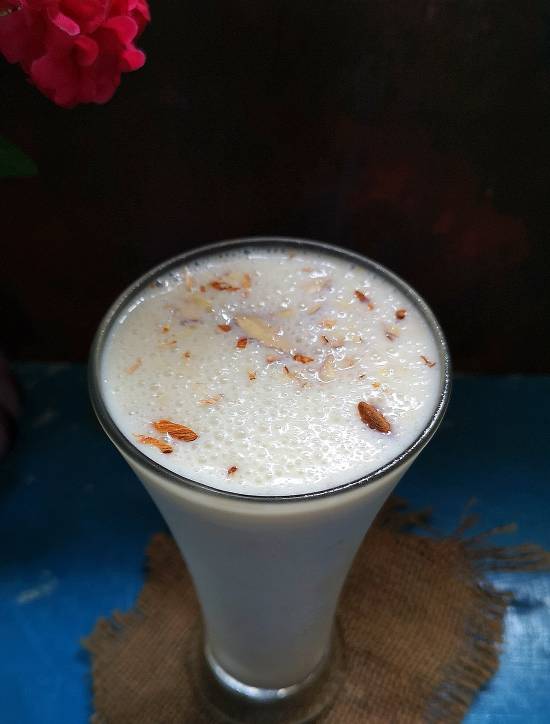 top view of Banana Milkshake Recipe garnished with almond flakes