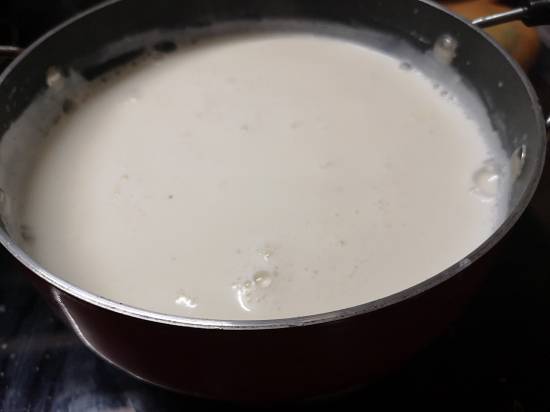 heating milk till the first boil comes for kesar paneer kheer recipe