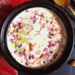 Close up view of Channar Payesh, Kesar paneer kheer loaded with almonds, pistas, kesar and rose petals, how to make kesar paneer kheer