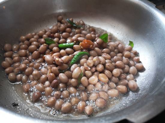 adding jaggery and chilies in Peanut Sundal | verkadalai sundal | nilakadalai sundal