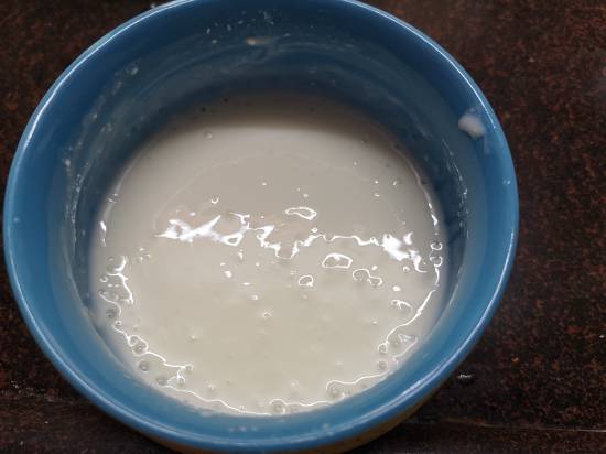 yogurt in a bowl for preparing vrat wale aloo