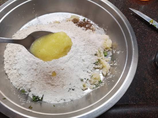 Adding 1 tbsp Desi Ghee and rock Salt to Vrat Wale Kuttu Parathas
