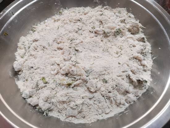 Mixing mashed potatoes and spices along with flour mixture for Vrat Wale Kuttu Parathas, Buckwehat Flour Parathas for Fasting