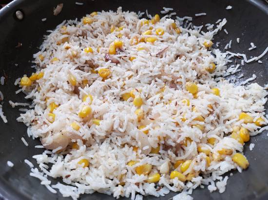 mixing it well forRecipe of Sweet Corn Pulao | How to make sweet corn rice