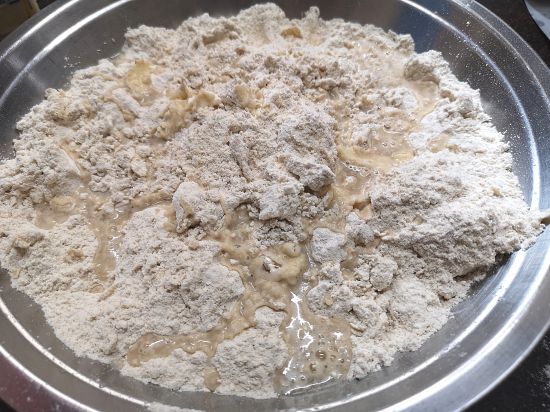 all purpose flour into a bowl with melted butter