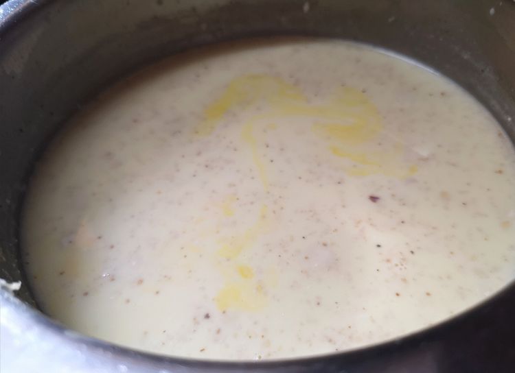 adding soaked saffron to the boiling milk, saffron almond milk recipe, benefits of kesar badam milk
