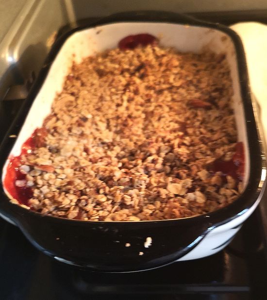 strawberry and oats crumble, ready to be baked in a baking tray
