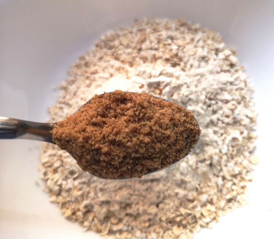 mixing organic jaggery powder for oats crumble