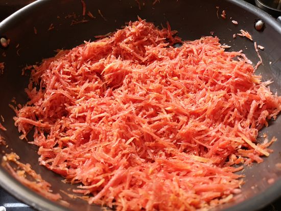 carrots being cooked for gajar halwa, recipe of carrot halwa