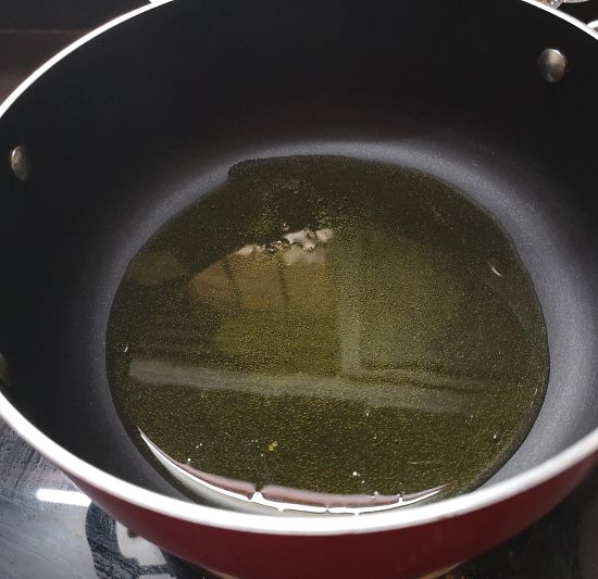 heat ghee in a pan for gajar ki barfi