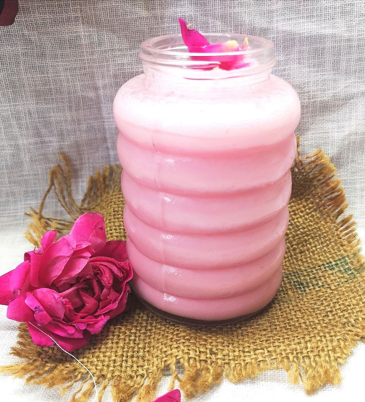 close up photo of Rose Lassi in a glass garnished with rose petals