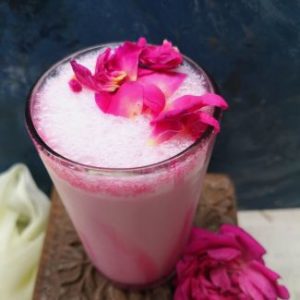 top view of delicious rose milkshake with rose petals, fasting rose milkshake recipe