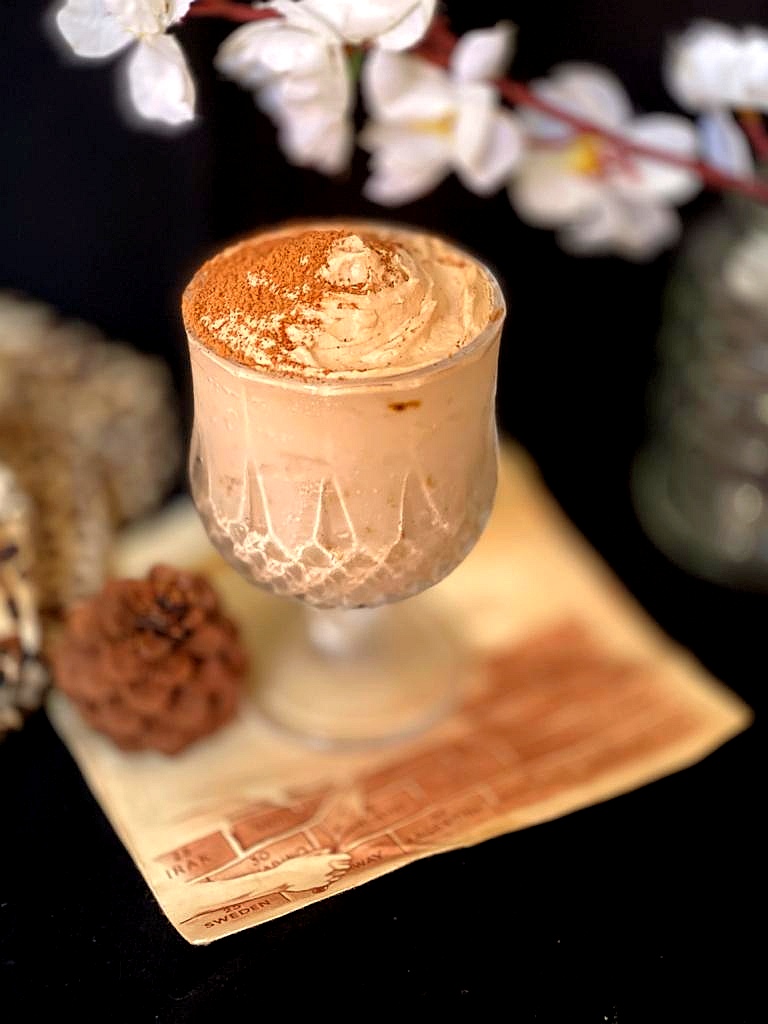 3 Ingredients Nutella Mousse Recipe, close up view of Nutella Mousse served in a glass and dusted with coco powder